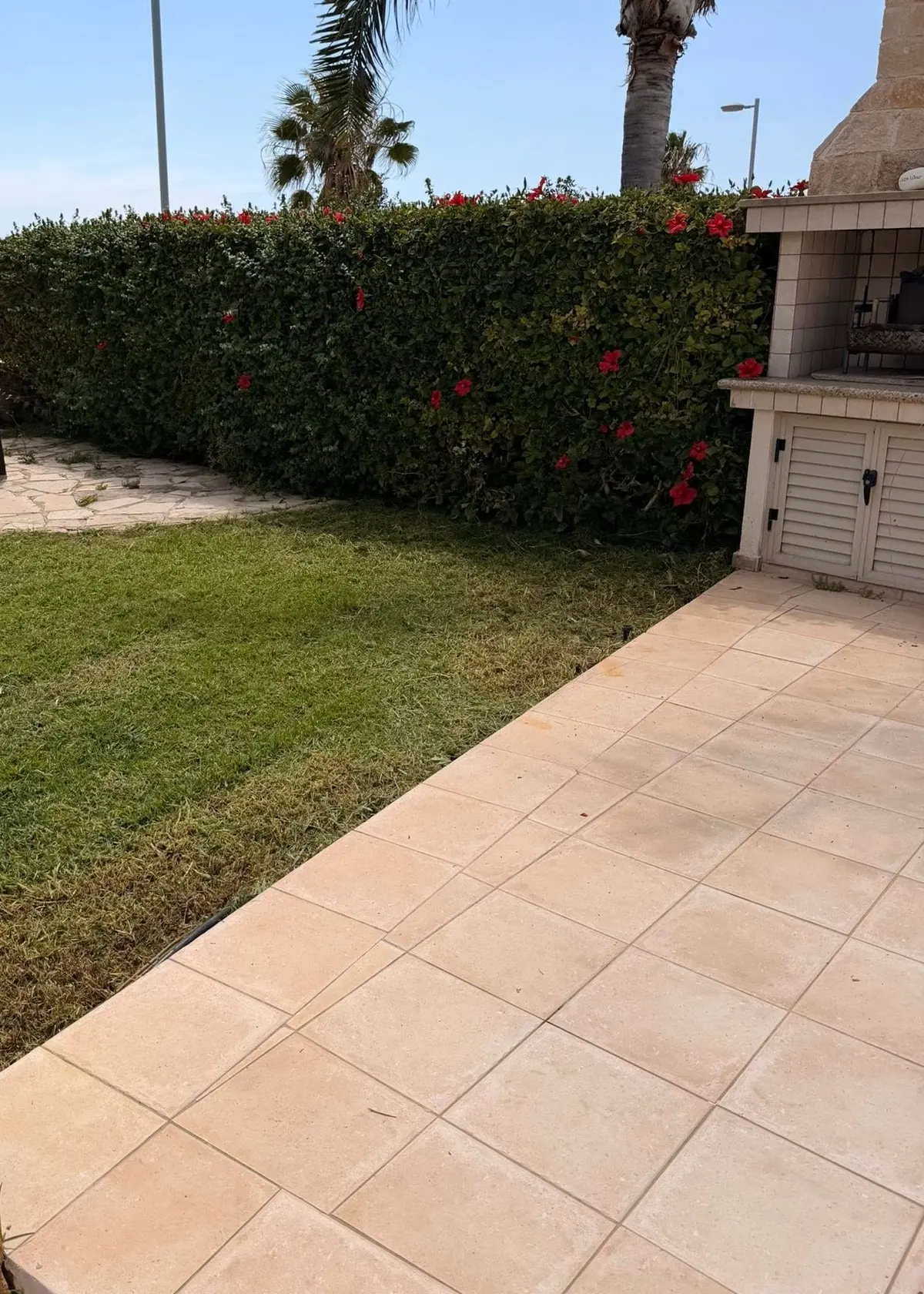 The same lawn cut short with clean edges